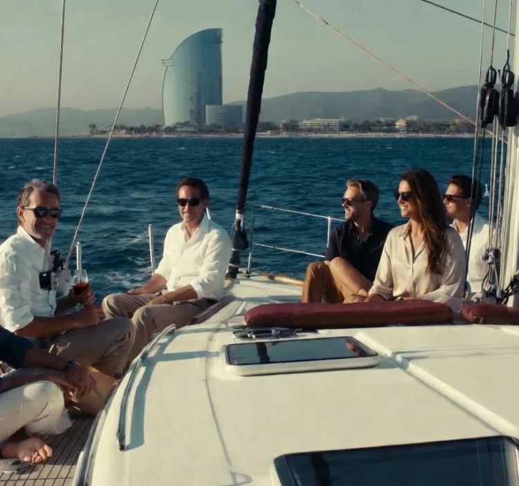 Group of friends enjoying a luxury sailing charter off the coast of Barcelona
